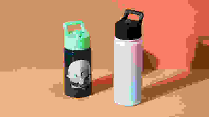 Two Simple Modern water bottles on an orange background.
