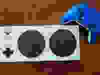 Adaptive Controller next to blue Xbox controller