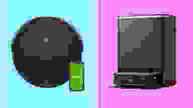 An iRobot and Ecovacs robot vacuum in front of colored backgrounds.