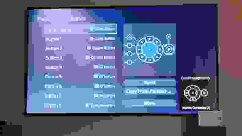 A photo of a TV with the button assignment screen showing.