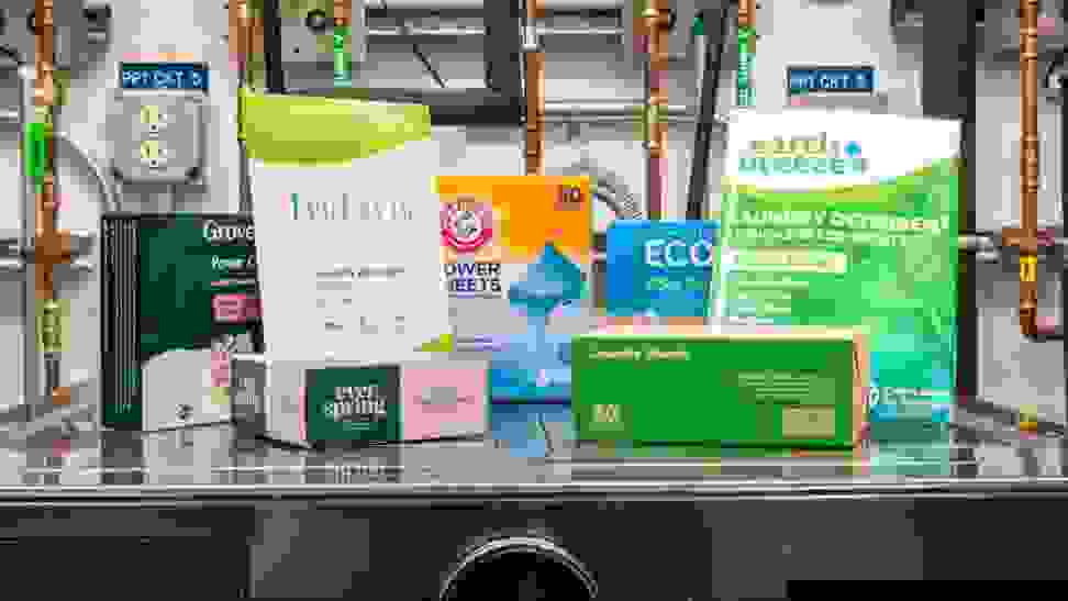 Grove Co., Tru Earth, Ever Spring, Arm & Hammer, Ecoas, Laundry Club, and Earth Breeze laundry sheets on a washing machine