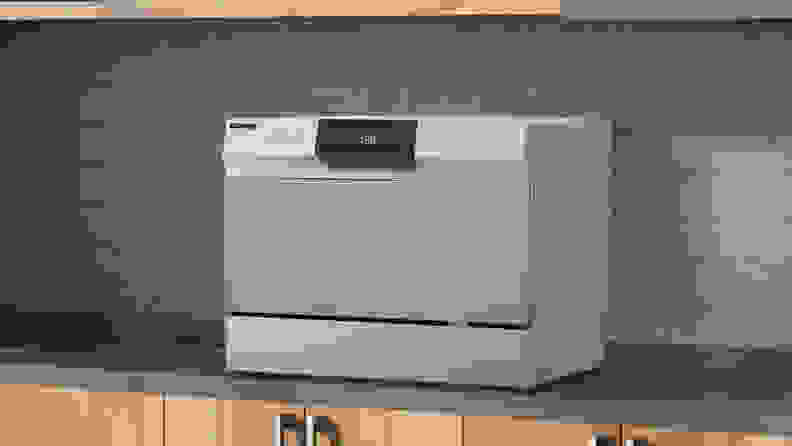 The Danby countertop dishwasher set up on a kitchen counter.