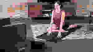 Woman practicing yoga at home.