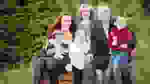 A large family taking a photo for their Christmas card.