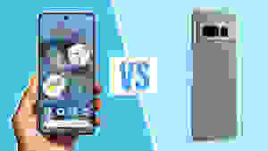 A person holding a Google Pixel 7 Pro next to a Google Pixel 8 Pro smart phone.