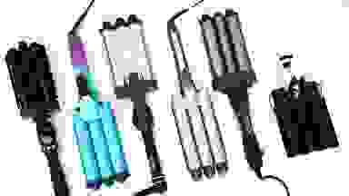 Six hair wavers lay in a row with the barrel ends facing the same direction every other waver.
