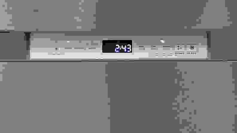 A close-up of the Maytag MDB4949SKZ dishwasher's front-facing control panel. The buttons, from left to right are: PowerBlast, Auto, Normal, Quick, High Temp, SSSani Rinse, Heated Dry, Start and Cancel. Each button has an LED indicator light over it and there's a digital display after the first four cycle buttons.