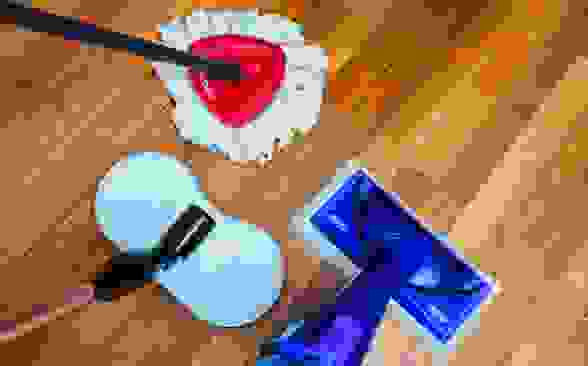 Three of the best mops we tested sit on a shiny hardwood floor