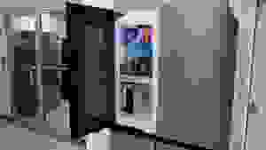 The Samsung Bespoke Refrigerator RF23DB9700QL inside of the Reviewed testing lab nestled between two doors.