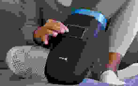 Close-up photo of a model enjoying the LifePro Hand Massager.