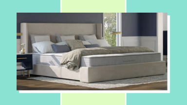 Large mattress in a bedroom with sheets and pillows