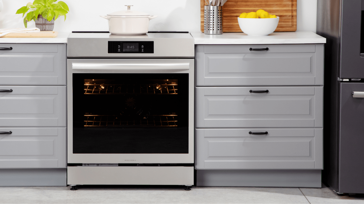 Frigidaire Gallery GCFI3060BF 30-inch Induction Range in between two drawers in modern kitchen setting.