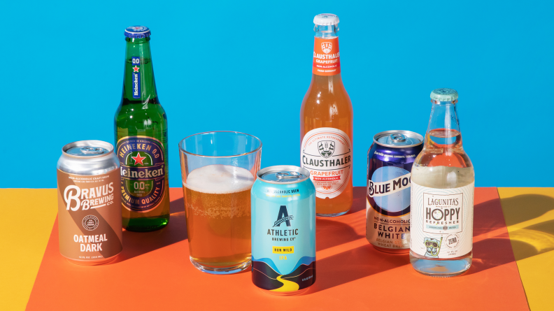 Various cans and bottles of the best non-alcoholic beer on a colorful surface