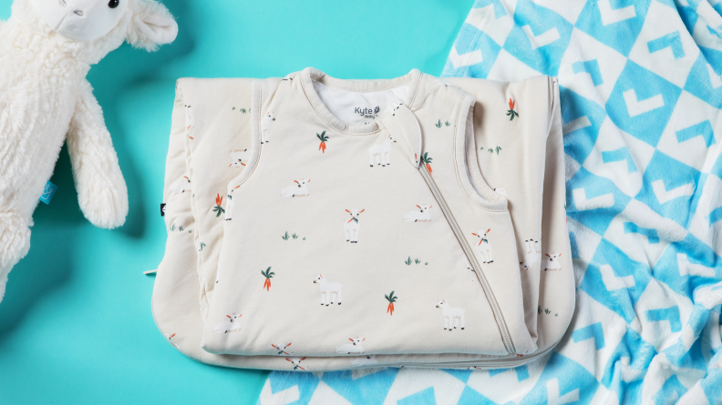 The Kyte Baby sleep sack on a green background