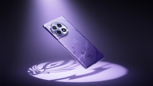 The back of the purple Genshin Impact edition OnePlus 12R smartphone floating while illuminated by a purple spotlight.