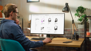 Man online shopping at home office desk